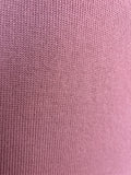 Close-up of a dusty pink superfine kangaroo island wool knitted jersey fabric texture