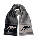A fair isle scarf with geometric patterns and kangaroo silhouettes in black and dune colors.