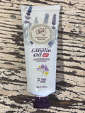 Tube of Australian Lanolin Oil Wild Field on a textured wooden surface
