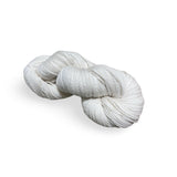 A skein of natural Kangaroo Island Wool knitting yarn on a plain background.